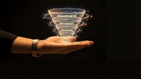 Businessman hand holding glowing sales funnel with awareness, interest, decision, action stages on dark background, marketing strategy concept.