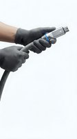 Hands in protective gloves holding USB flash drive on white background for technology and data storage concepts.