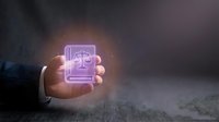 Businessman hand holding glowing purple legal justice scale icon representing law, attorney services, and judicial system in modern digital concept.