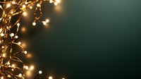 Glowing warm white fairy lights creating magical bokeh effect against dark green background, festive holiday decoration for Christmas and celebrations.