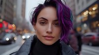 Young woman with purple and black ombre hair wearing black turtleneck in urban city street setting during evening hours with blurred traffic and buildings.