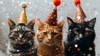 Three cats wearing festive party hats with glitter and pom-poms against a gray background with falling confetti, celebrating a special occasion.