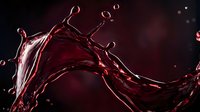 Dynamic red wine splash with droplets frozen in motion against a dark dramatic background, perfect for beverage and luxury brand advertising.