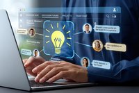 Business professional using laptop with digital innovation interface displaying lightbulb idea concept and team collaboration chat messages for creative brainstorming.