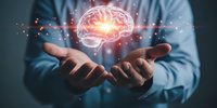 Businessman holding glowing brain with neural network connections representing artificial intelligence, machine learning and innovative technology solutions.