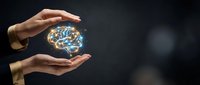 Hands protecting glowing brain with neural networks symbolizing mental health care, artificial intelligence and cognitive protection in healthcare technology.