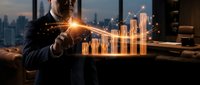 Businessman analyzing glowing financial data charts and graphs with city skyline background in modern office setting for business growth strategy.