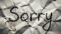 Word Sorry handwritten on crumpled dirty paper texture, expressing regret, apology, and forgiveness concept for emotional designs.