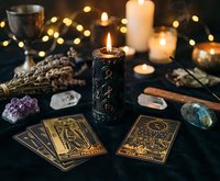 Mystical tarot cards spread with burning candles, crystals and warm lighting creating atmospheric fortune telling scene for spiritual guidance and divination.