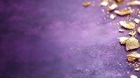 Golden glitter and sparkle fragments scattered on purple textured background with copy space, creating luxurious festive mood for holiday designs.