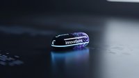 Transparent USB flash drive with innovations text on laptop keyboard showcasing modern technology and data storage solutions for business presentations.