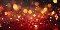 Red and gold glowing bokeh lights on dark background with sparkle effect, creating magical festive atmosphere for holiday designs and celebrations.