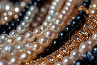 Elegant pearl necklaces and golden jewelry strands in macro view showing luxurious texture and sparkle, arranged in parallel lines with selective focus effect.