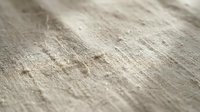Weathered wooden surface with natural grain patterns and rustic texture for interior design and construction projects.