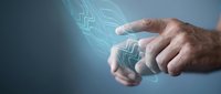 Human hand touching glowing digital circuit brain representing artificial intelligence and neural network technology for futuristic innovation concepts.