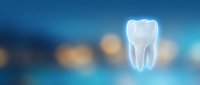 White tooth floating on blue medical background with soft bokeh lights for dental care and oral health concepts.