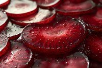 Fresh sliced red strawberries with water droplets in macro photography, showing juicy texture and vibrant color for food styling and culinary presentation.