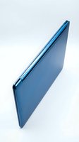 Sleek blue laptop computer displayed at an angle against white background, showcasing modern design and metallic finish for technology and business concepts.
