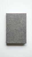 Closed hardcover book with gray linen fabric binding on white background, isolated for design, publishing, education, and stationery projects.