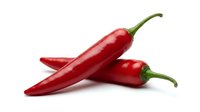 Fresh red chili peppers isolated on white background, ready for culinary, food, and cooking design projects.
