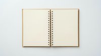 Open blank notebook with spiral binding on white background for writing notes and planning projects.