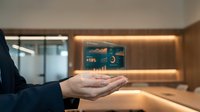 Business professional presenting financial data analytics with holographic display showing charts and statistics in modern office environment.