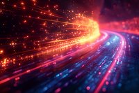 Abstract digital light trails in vibrant orange and blue colors creating futuristic data stream effect against dark background.