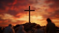 Wooden cross silhouette on rocky hill against dramatic orange sunset sky with person praying in shadow, spiritual worship and faith concept.
