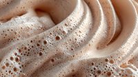 Creamy chocolate mousse swirl with airy bubbles and smooth texture for dessert photography, culinary arts, food styling and gourmet cooking presentations.