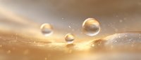Shimmering water drops on golden feather macro with soft bokeh and light effects, creating dreamy atmospheric nature background for luxury cosmetic advertising.