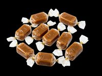 Caramel candies wrapped in clear cellophane with gold twist ties, isolated on transparent background. Ready for clipart, print-on-demand, sublimation, stickers, and design projects.
