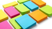 Colorful sticky notes arranged in overlapping rows featuring yellow, pink, lime green, blue, and orange tones. Isolated on white background, ready for office, education, organization, and reminder design projects.