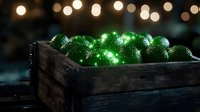Glowing green Christmas ornaments in rustic wooden box with soft bokeh lights in background create magical holiday atmosphere.