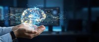 Digital brain hologram floating above businessman hand with neural network connections and data visualization in modern office technology concept.