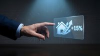 Businessman hand touching holographic interface showing house icon with 15% growth arrow indicating real estate market increase and property investment success.