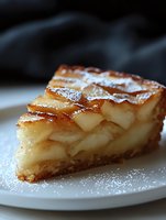 Slice of homemade apple pie with layered thinly sliced apples, dusted with powdered sugar on white plate. Close-up view shows flaky golden crust and caramelized fruit filling.