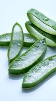 Fresh sliced okra with water droplets on white background, isolated vegetable for cooking, healthy food ingredient, culinary use.