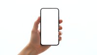 Hand holding modern smartphone with blank white screen mockup isolated on white background for app presentation and digital marketing materials.