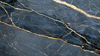 Dark blue marble texture with golden veins running diagonally across polished stone surface, natural luxury pattern for interior design and architecture.