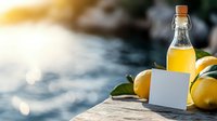 Fresh lemonade in glass bottle with blank label and ripe yellow lemons on wooden surface against blurred water background with sunlight reflections.