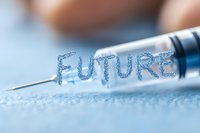 Word future written with liquid drops from medical syringe needle on blue surface, representing healthcare innovation and medical advancement.