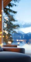 Digital interface icons overlaid on window with mountain view and bokeh lights, representing smart home technology and connectivity.