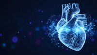 Digital wireframe human heart with glowing particles on dark blue background for medical technology and healthcare innovation presentations.