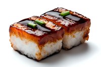 Grilled unagi sushi rolls with eel sauce, cucumber strips and white rice on black background, traditional Japanese cuisine served at restaurants and sushi bars.