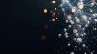 Glowing network connections with orange and white light particles floating in dark space create futuristic technology visualization for business concept.