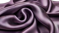 Luxurious purple silk fabric with elegant folds and waves creating smooth flowing curves and graceful draping effect. Soft satin texture with light reflections.