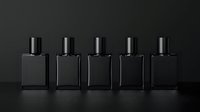 Black glass perfume bottles arranged in row on dark background with reflection, minimalist luxury cosmetic packaging design for fragrance industry.