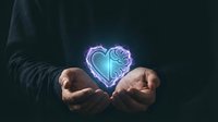 Hands holding glowing neon heart with rose design floating above palms against dark background for romantic and love concepts.