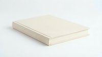 Blank cream colored hardcover book lying flat on white background isolated for mockup and design projects.