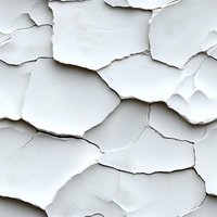Cracked and peeling white paint texture showing layers of deterioration on wall surface, creating abstract pattern of flaking fragments. Suitable for design backgrounds.